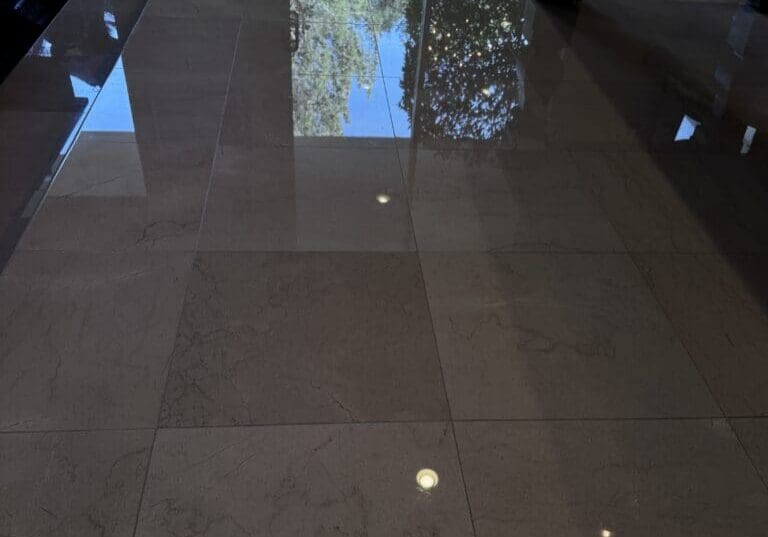 Highly polished marble floor with mirror-like reflection in a Las Vegas home after professional stone polishing
